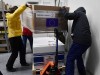 A Moderna újabb, koronavírus elleni vakcinaszállítmányát viszik a Hungaropharma hűtőkamrájába. Fotó: Koszticsák Szilárd